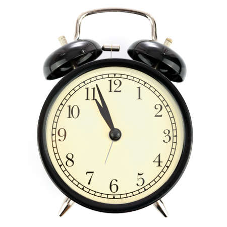 Classical retro alarm clock isolated on a white background with no shadows in close-up