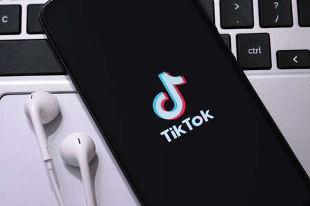 Krakow, Poland - October 16, 2020:  Tiktok sign on the smartphone screen. Tiktok is a famous social media network for share videosのeditorial素材