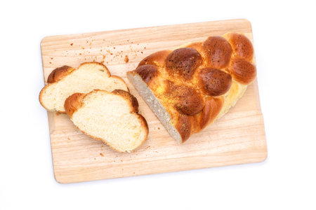 Top view of a traditional sweet braided yeast bread called - zopf, challah, petticoat or brioche on...