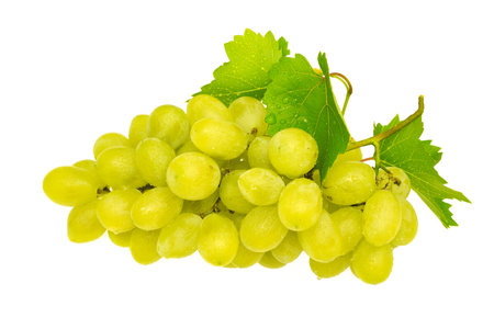 Ripe fresh bunch of yellow grapes and green leaves with drops of water and dew isolated on a white backgroundの写真素材