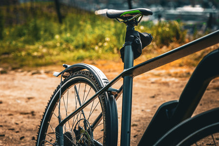 Close up of bicycle wheel and tire on the road in the park