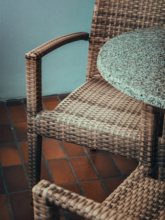 Wicker chair and table in coffee shop - Vintage filter processing style