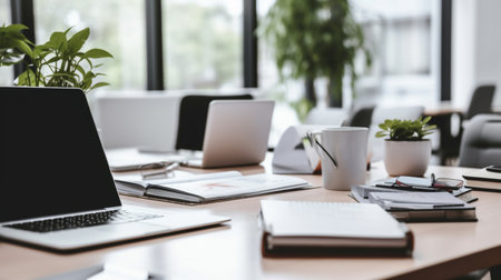 Selective focus of table laptop. Contemporary Office Table, documents chairs in officeの素材