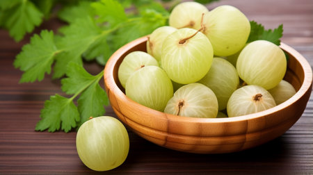 Fresh Amla (Indian gooseberry) fruits with cut in half and leaves isolated on white backgroundの素材
