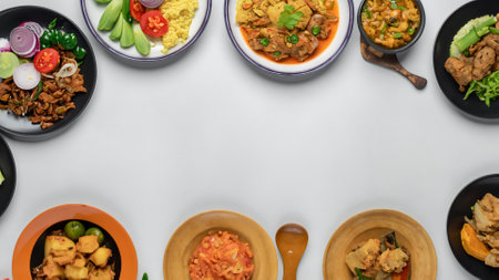 Many different indonesian food dishes from top view with blank spaceの素材