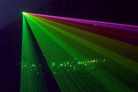 Color laser beams fantail in a haze