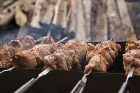 Pices of pork grilled on skewers closeupの写真素材