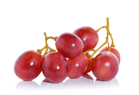 Red grapes isolated on white backgroundの写真素材