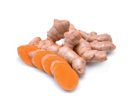 Turmeric roots on white background