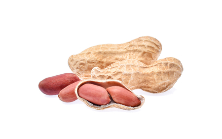 Dried peanuts in closeup on white backgroundの写真素材