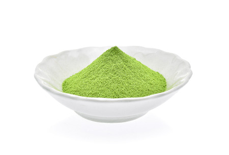 Powder green tea isolated on white backgroundの写真素材