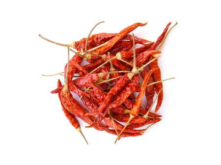 dried chili peppers on white backgroundの写真素材