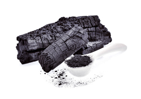 Natural wood charcoal isolated on white backgroundの写真素材