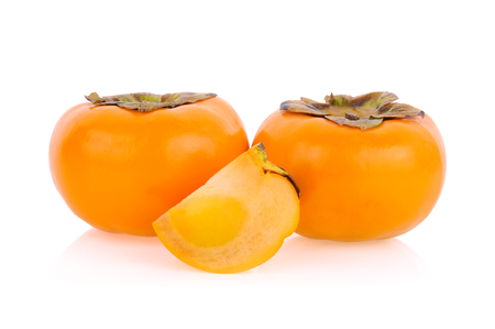 ripe persimmons isolated on white backgroundの写真素材