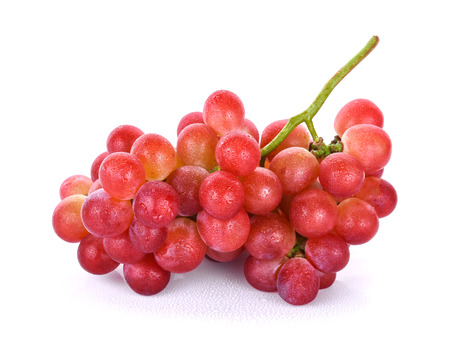 red grapes with water drops isolated on white backgroundの写真素材