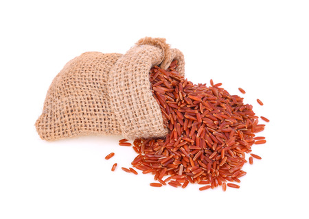 red rice isolated on white backgroundの写真素材