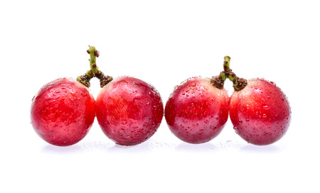 Red grapes with water drops isolated on white backgroundの写真素材