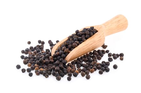 Black pepper corns isolated on white backgroundの写真素材