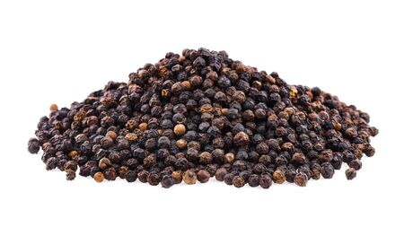Black pepper corns isolated on white backgroundの写真素材