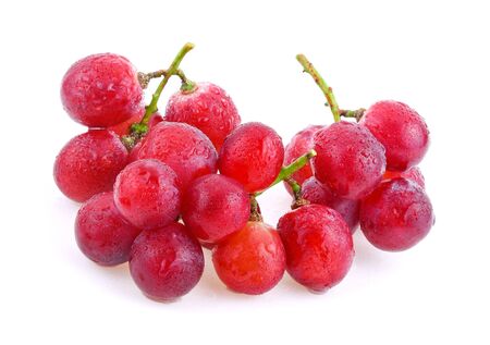 red grapes with water drops isolated on white backgroundの写真素材