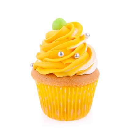 Yellow cupcake isolated on white backgroundの写真素材