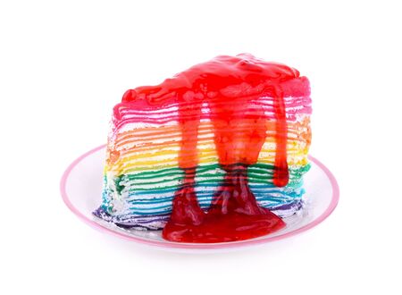 Rainbow Crape cake with strawberry Sauce isolated on white backgroundの写真素材