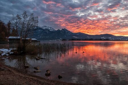 The Bavarian mountain lake Kochelsee in the sunset