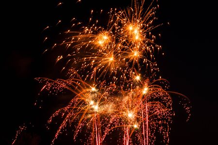 Fireworks rockets explode in the skyの写真素材