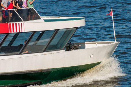 A harbor ferry on the Elbe in the port of Hamburgの写真素材