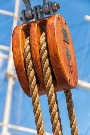 Double block with rope on a sailing shipの写真素材
