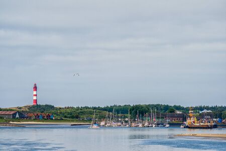 The port and lighthouse of Amrum on the North Seaの写真素材