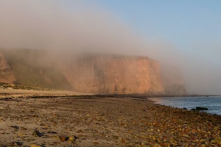 The cliffs of the island of Helgoland in the fog