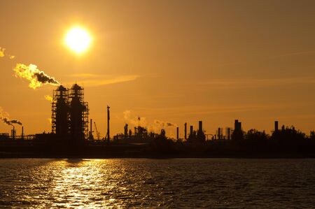 An industrial plant in Stade on the Elbe in the sunset