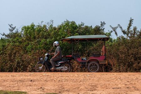 A motorcycle rickshaw in Cambodiaの写真素材
