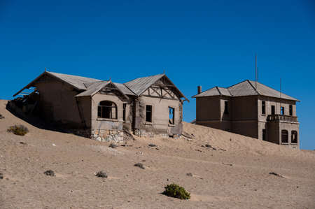 Abandoned house filled with desert sand in Kolmanskop, Namibiaの写真素材