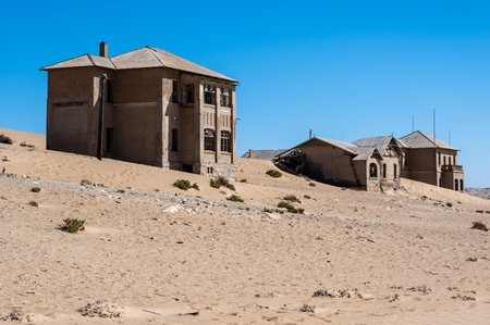 Abandoned house filled with desert sand in Kolmanskop, Namibiaの写真素材