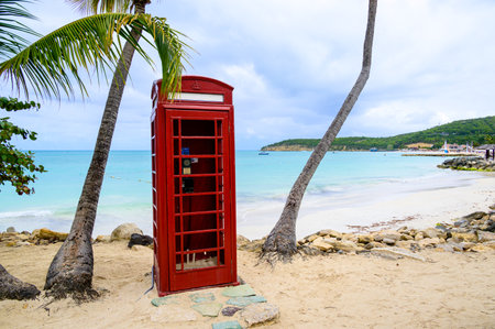 Phone booth in Dickenson Bay on Antigua in the Caribbeanの写真素材