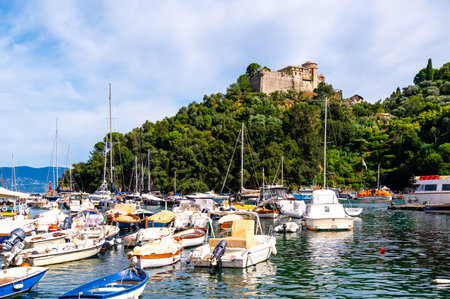 Old medieval castle, located on a hill near harbor of Portofino town, Italyの写真素材