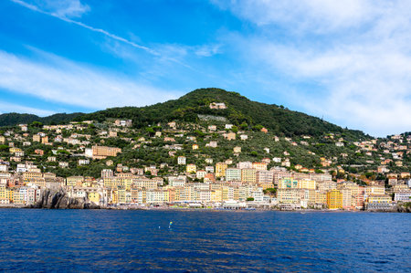Colorful buildings and beach at Camogli on sunny summer day, Liguria, Italyの写真素材