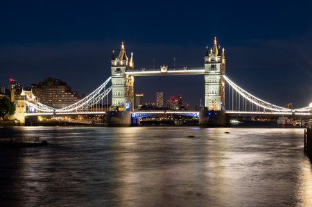 Tower bridge in London England at night over Thames riverの写真素材