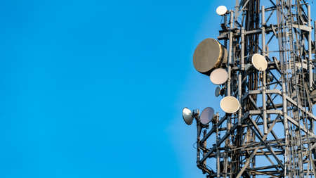 Large Telecommunications tower with various communications broadcast equipmentの写真素材