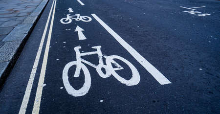 Cycle lane markings painting on a roads surfaceの写真素材