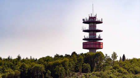 Shot of large manned transmission tower on a hillsideの写真素材