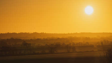 Golden sunrise over the countrysideの写真素材