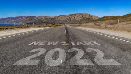New Start 2022 written on highway road to the mountainの写真素材
