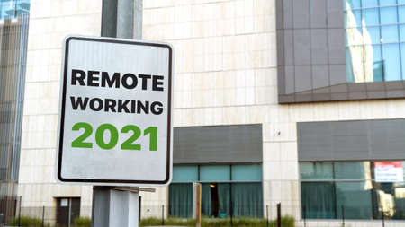 Remote working 2021 sign in a downtown city settingの写真素材