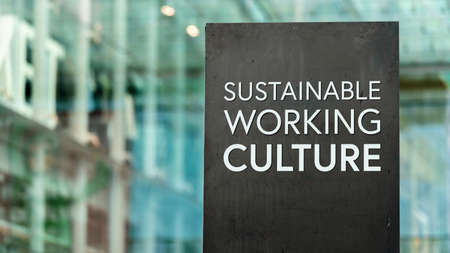 Sustainable Working Culture sign in front of a modern office buildingの写真素材