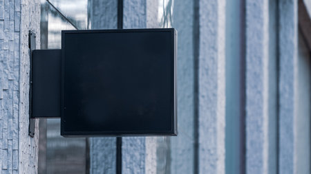 Blank Black shop sign on a city high streetの写真素材