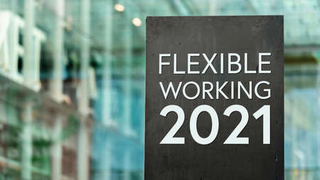 Flexible Working 2021 sign in front of a modern office buildingの写真素材