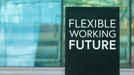 Flexible Working Future sign in front of a modern office buildingの写真素材